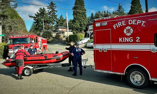Adult & child rescued from overturned boat on Puget Sound by firefighters Sunday