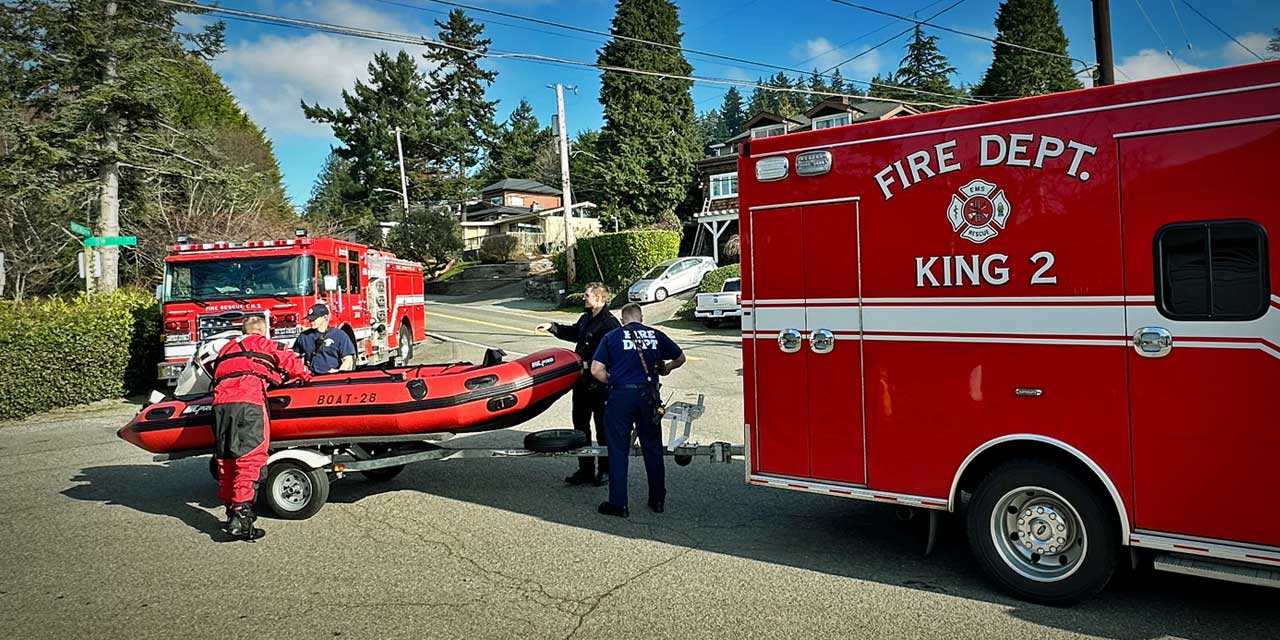 Adult & child rescued from overturned boat on Puget Sound by firefighters Sunday