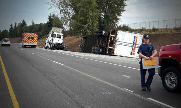 Semi rollover shuts down SR 509, triggers hazmat response Wednesday morning